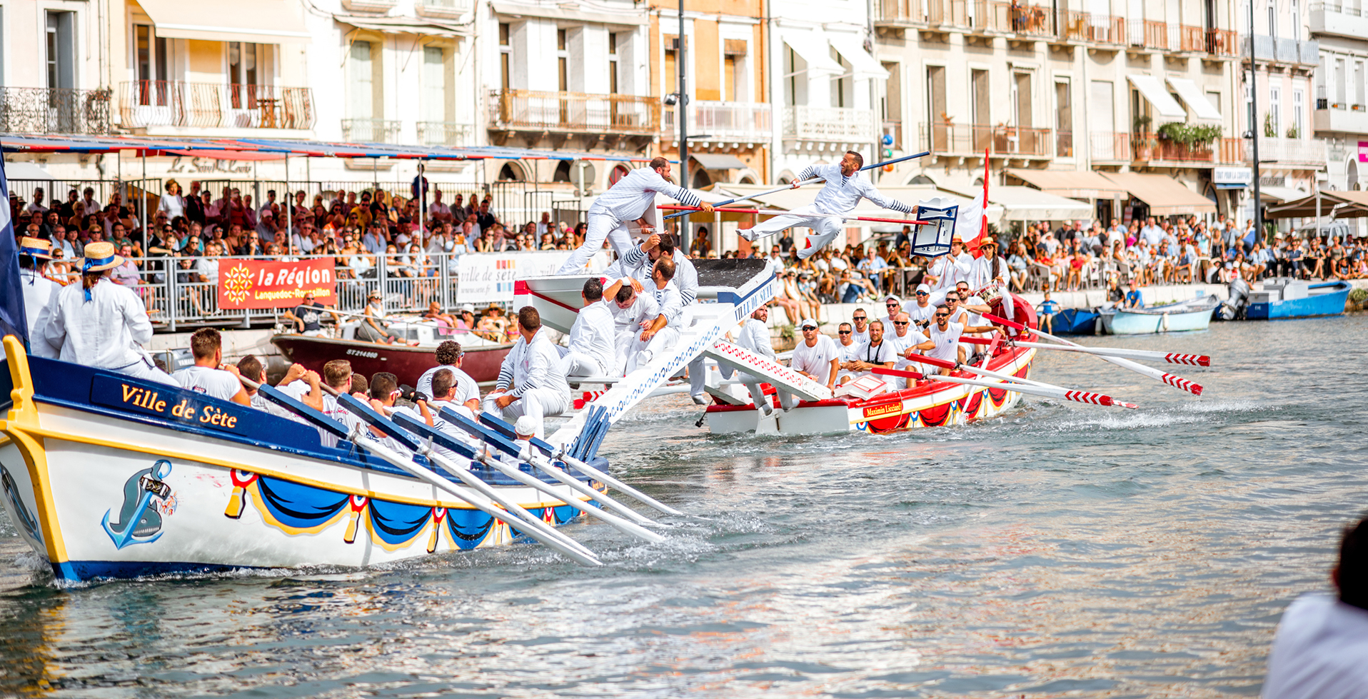 SETE, FRANCE - July 30, 2017: Water jousting competition which lasted in Sete on the south of France. Jousting is a fight on the boat practised principally in France