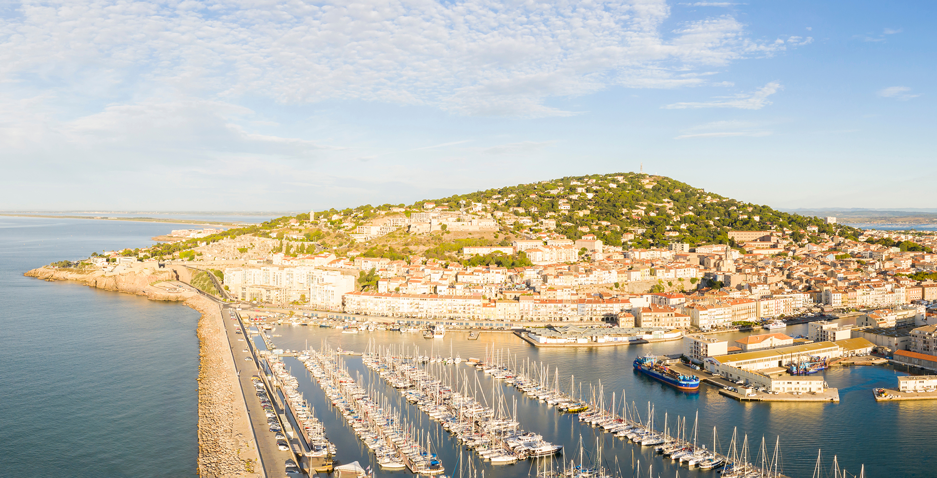 Aerial panorama of the marina of the port of Sete on a summer morning, in Herault in Occitanie, France